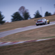 The Porsche 992 hot on the track in Indianapolis.